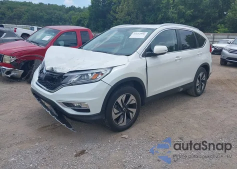 2016 Honda Cr-V Touring z USA, uszkodzony, nr VIN 5J6RM4H95GL118070
